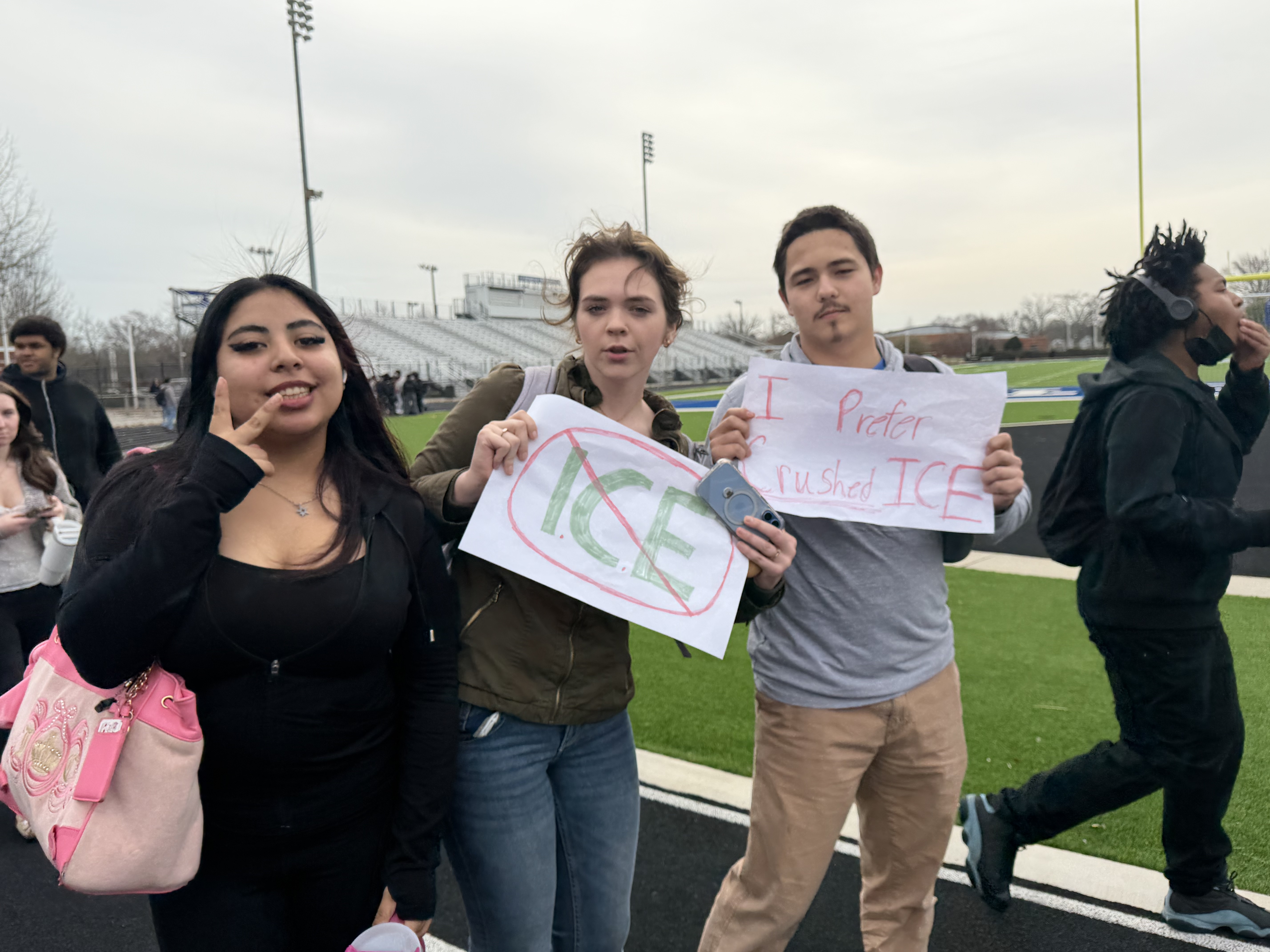 A norview student holding a sign reading 'I Prefer Crushed ICE.'